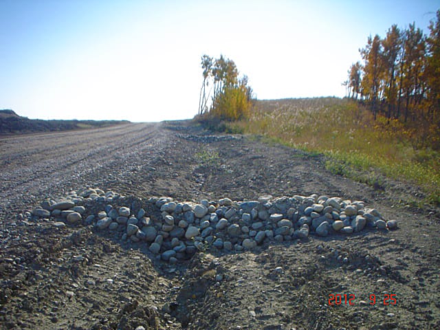 Rock check dam built for erosion control on an AESC job site